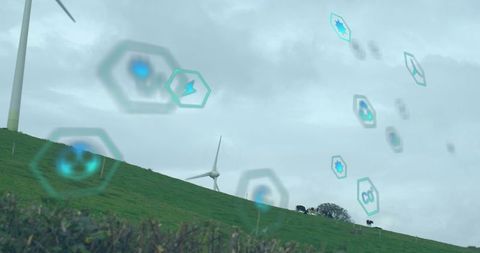 Digital Icons Overlaying Wind Turbines and Countryside Landscape