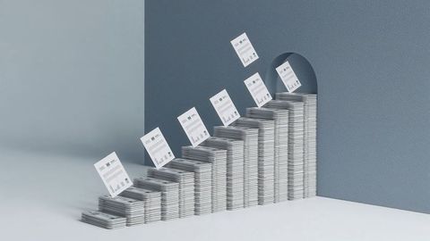 Stacks of documents with charts leading to archway in modern room