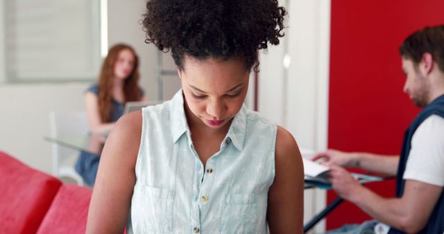 Young African American Woman Concentrating at Modern Office - Download Free Stock Images Pikwizard.com