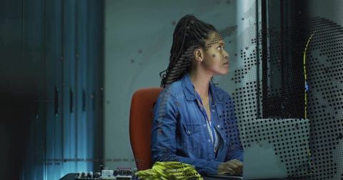Female technician testing monitor and repairing electronics at modern tech workstation