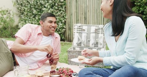 Young Couple Enjoying Cozy Picnic Outdoors