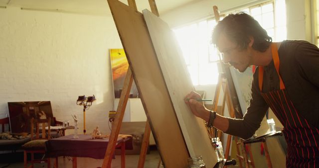 Artist Creating Masterpiece on Canvas in Sunlit Studio - Download Free Stock Images Pikwizard.com