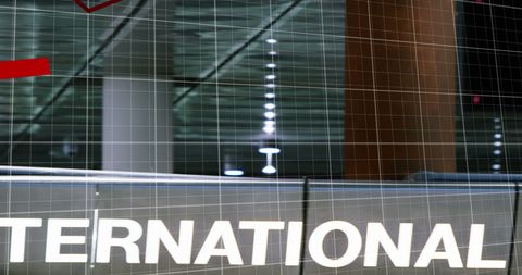 Economic crisis depicted by red graph at modern airport