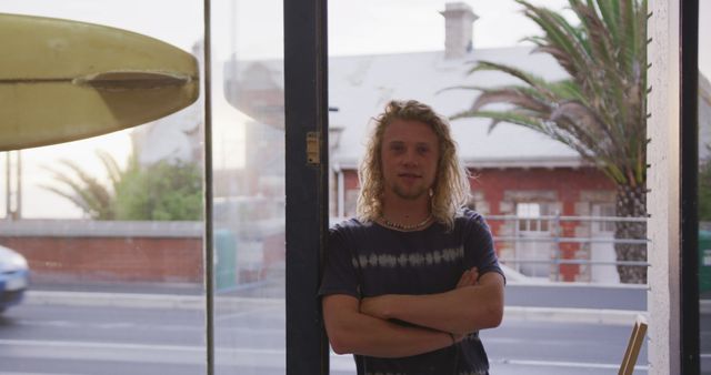 Confident Male Surf Shop Owner Standing with Arms Crossed in Store - Download Free Stock Images Pikwizard.com