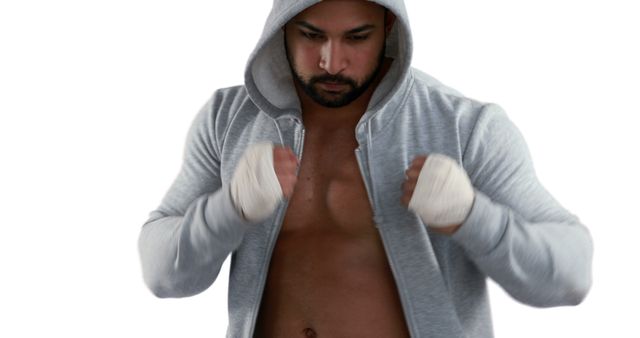 Boxer in Grey Hoodie Gearing Up for Intense Training Session - Download Free Stock Images Pikwizard.com