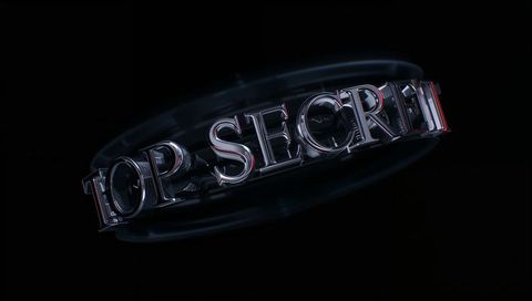 Rotating chrome top secret 3d typography with reflective red rim halo