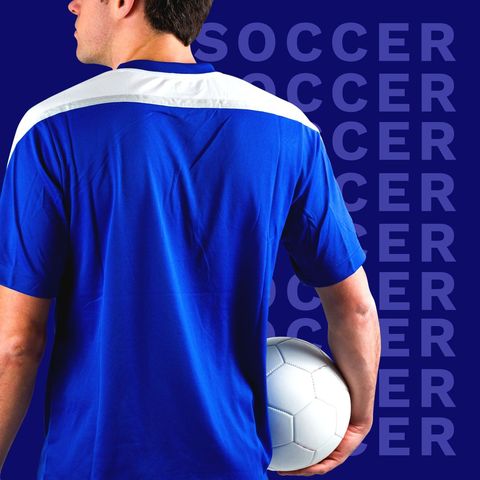 soccer player holding ball in blue jersey - Download Free Stock Templates Pikwizard.com