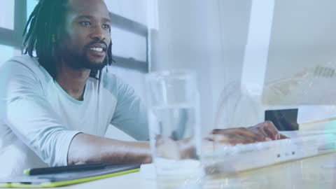 Young Entrepreneur Working in Modern Office with Technology