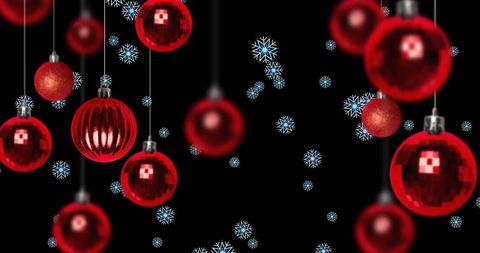 Festive Red Baubles with Falling Snowflakes on Black Background