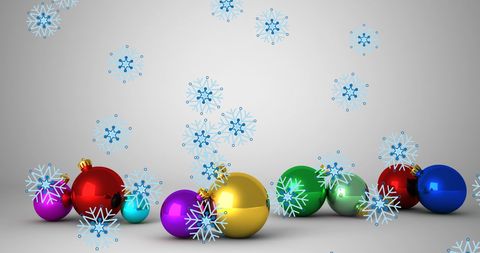 Colorful Christmas Baubles with Falling Snowflakes for Holiday Celebration