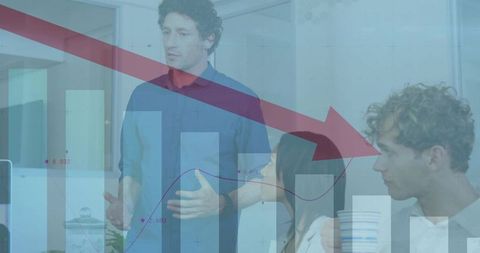 Business presentation analyzing declining charts in meeting room