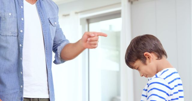 Father Disciplining Young Son at Home - Download Free Stock Images Pikwizard.com