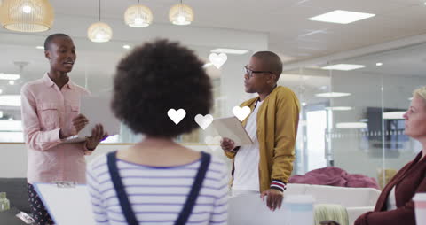 Animated Hearts Float in Diverse Office Team Meeting