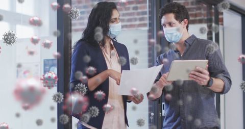 Colleagues wearing masks around covid-19 cells in office