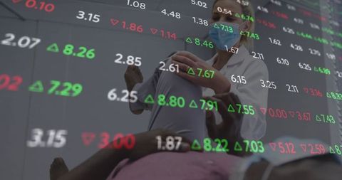 Physical Therapist Supports Patient With Stock Market Data Overlay