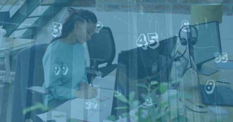 Financial Analyst Working in Modern Office Over Transparent Data Interface