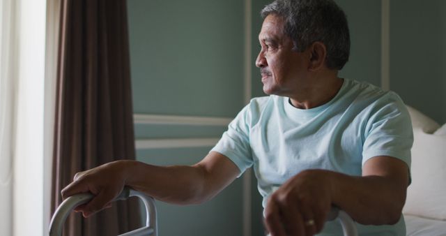 Senior Man Using Walker Gazing Out Window in Living Room - Download Free Stock Images Pikwizard.com