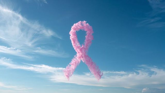 Pink smoke ribbon in sky symbolizing breast cancer awareness