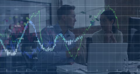 Business Professionals Collaborating Amidst Financial Graphs