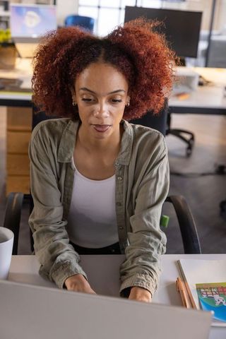 Focused Professional Woman Working in Modern Office Environment