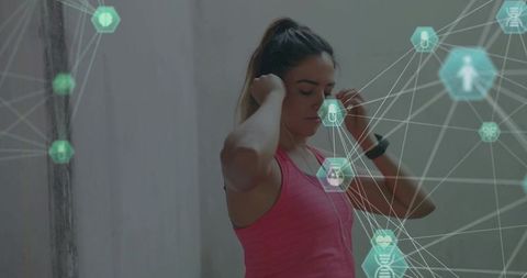 Woman Adjusting Earbuds While Wearing Smartwatch During Futuristic AR Fitness Training