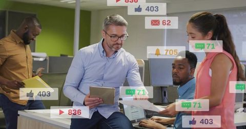 Team reviewing documents with manager using tablet in open office with social media overlays