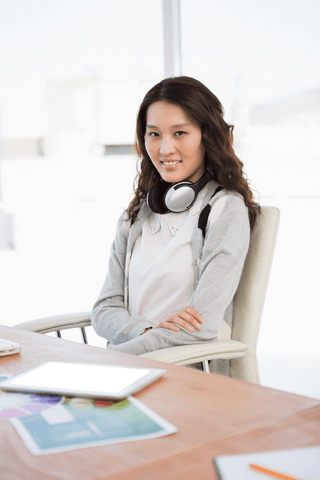 Transparent Businesswoman With Headphones In Modern Office Setting