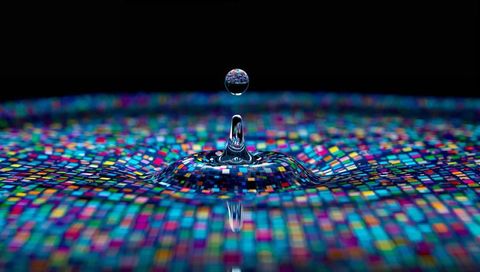 Vibrant Pixel Mosaic Reflecting in Suspended Water Droplet and Splash Macro on Black