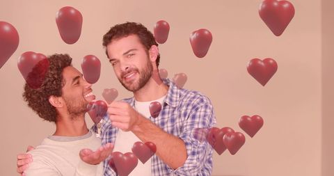 Romantic male couple surrounded by floating hearts