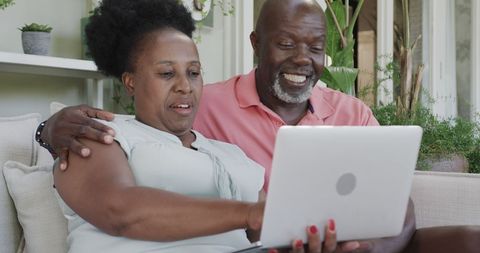 Senior African American Couple Enjoying Technology at Home