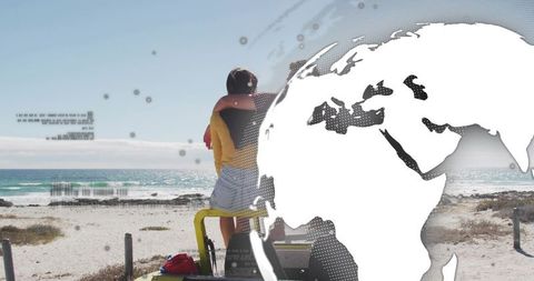 Couple embracing on beach with globe overlay, travel romance concept, ocean view, coastal connection