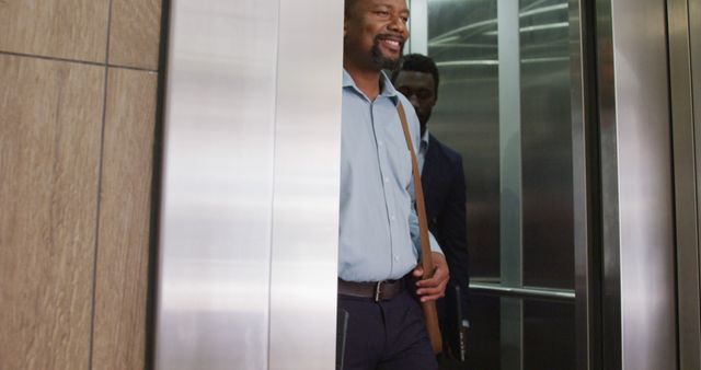 Diverse business people using elevator at office. Business, corporation, working in office and cooperation concept.