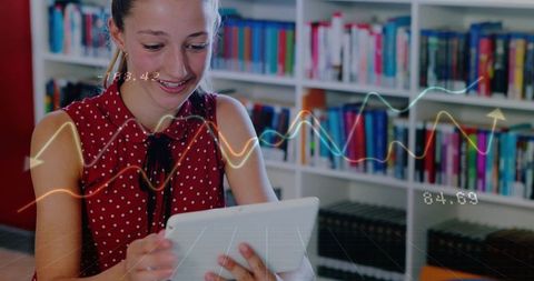 Teen studying with tablet in library with augmented data overlays for digital learning