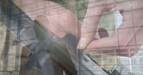 Double Exposure of Woman Handling Gun Against Businessman Silhouette