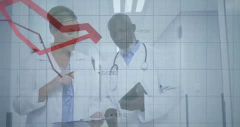 Doctors Analyzing Medical Data in Hospital Corridor