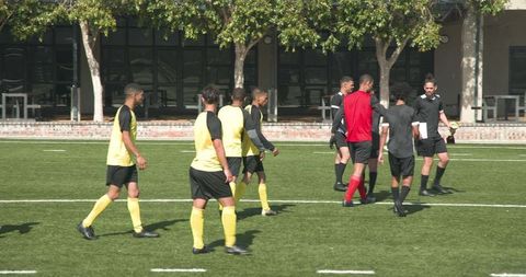 Soccer Players Shaking Hands Displaying True Sportsmanship