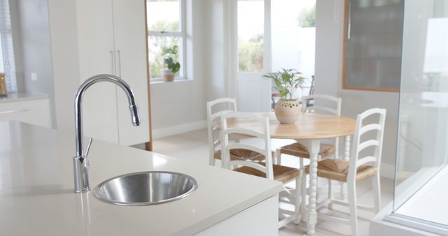 Modern Bright Kitchen with Dining Area and Wooden Table - Download Free Stock Images Pikwizard.com