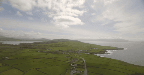 breathtaking transparent fields by the coast under cloudy sky - Download Free Stock Videos Pikwizard.com
