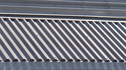 Abstract design patterns of corrugated metal sheet surface
