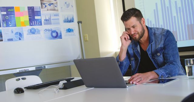 Young Professional Man Analyzing Data on Laptop in Modern Office - Download Free Stock Images Pikwizard.com