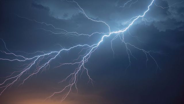 Dramatic Lightning Bolt in Night Sky During Storm