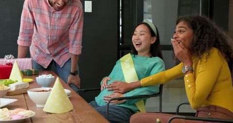 Colleagues Joyfully Celebrating Baby Shower in Office