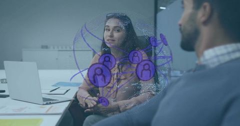 Coworkers Discuss Digital Network Hologram in Office Environment