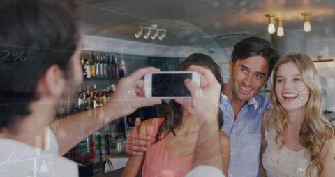 Young Friends Taking Group Photo at a Bar with Digital Interface Overlay