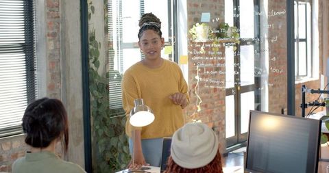 Diverse Women Engaging in Creative Office Brainstorming Session