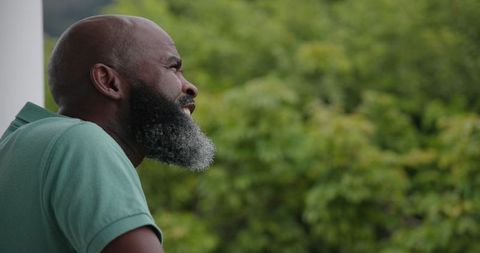 Man with Beard Enjoying Peaceful Outdoor View