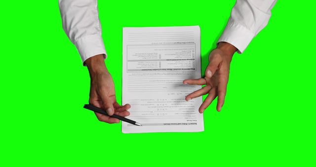 Businessperson Hands Holding Documents with Pen on Green Screen Background - Download Free Stock Images Pikwizard.com