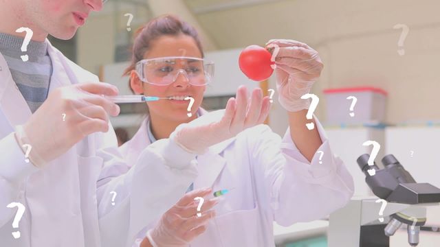 Scientists in a lab analyzing a tomato, with question marks overlayed suggesting confusion or inquiry. Ideal for use in educational content about scientific research, health studies, or medicine-related blogs. Perfect for illustrating questioning in scientific methodologies or uncertainties in research findings.