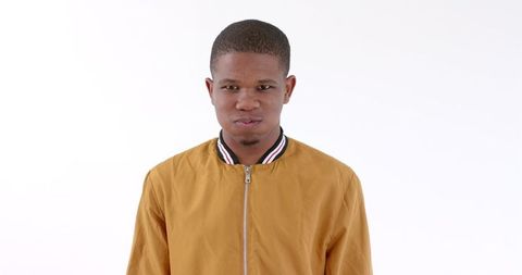 Confident african american man in stylish jacket smiling