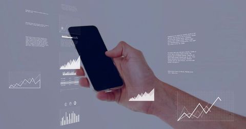 Holding black smartphone projecting augmented analytics holographic data charts on pale gray